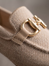 Close-up of beige mesh and gold-tone hardware
