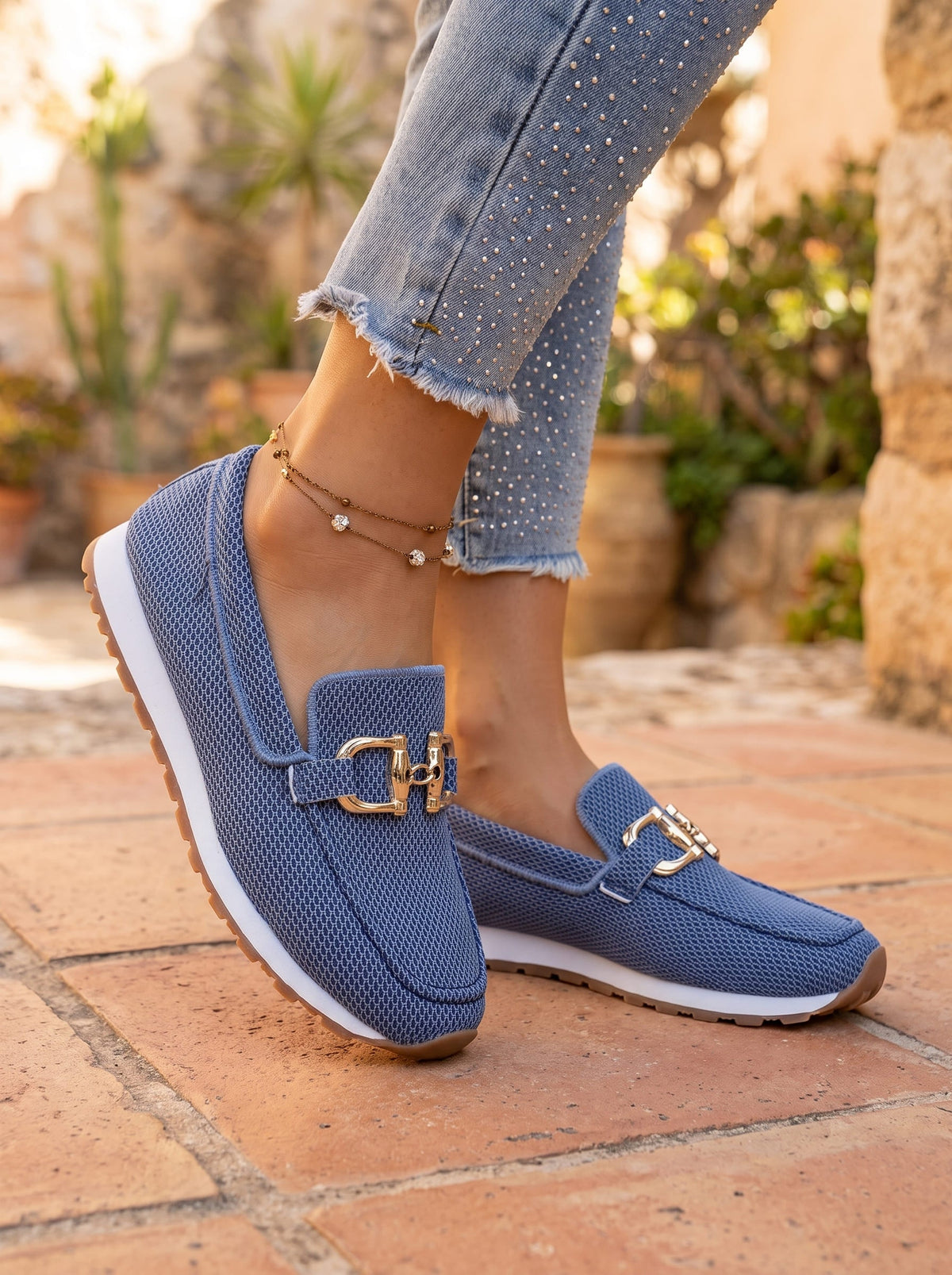 Woman wearing navy blue slip-on loafers
