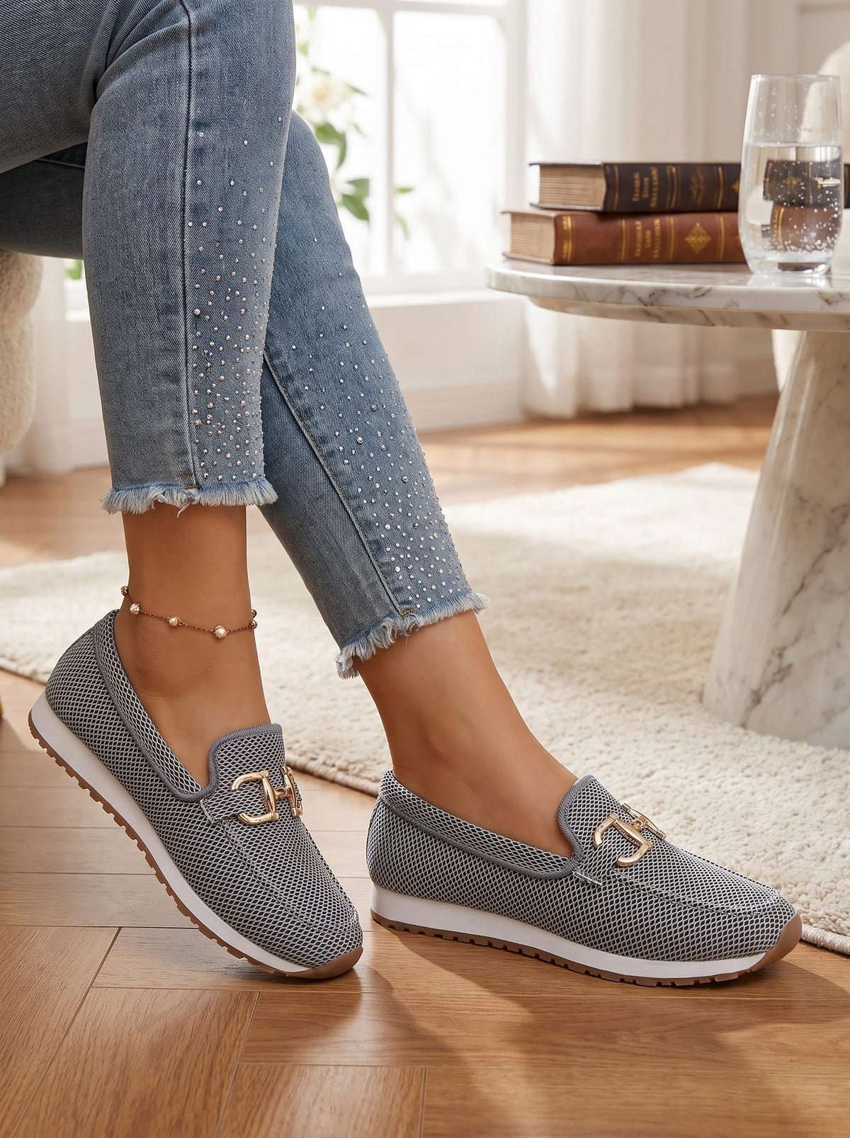 Woman wearing silver gray slip-on loafers