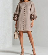 Taupe Aurelia dress on a Latina model