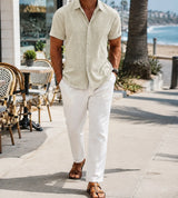 Cream Calder shirt in a relaxed coastal cafe setting