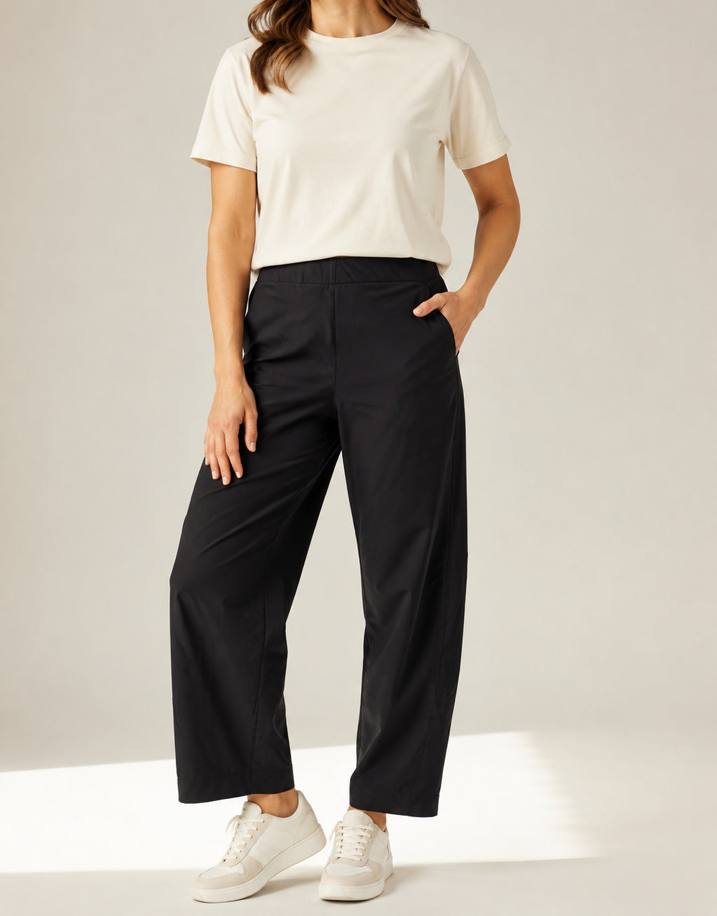 Black Aria barrel-leg pants on a model