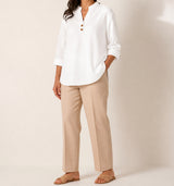 White Elara stretch slub linen-blend tunic blouse on an American model