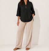 Black Elara stretch slub linen-blend tunic blouse on an American model