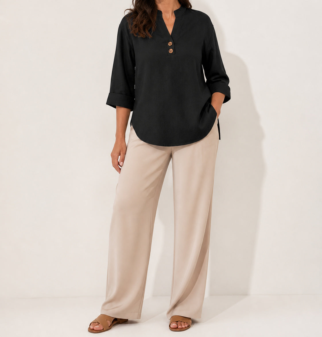 Black Elara stretch slub linen-blend tunic blouse on an American model