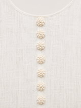 Aurelia round neckline and floral button detail