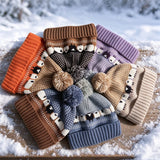Sheep-pattern Fair Isle beanies in a winter setting